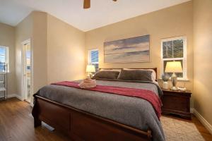 a bedroom with a large bed with two lamps at Healdsburg Wine Country Escape with Tasting Perks & Vineyard Views in Healdsburg
