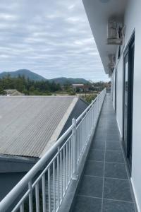 a balcony with a view of a roof at Anh Dung Homestay in Ga Thừa Lưu +2 photos