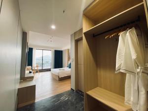 a hotel room with a bed and a closet at Fan's Hotel Palo in Tacloban +77 photos