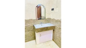 a bathroom with a sink and a mirror at Victoria Nature Resort in Digana