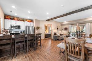 a kitchen and living room with a table and chairs at Timberline Hideaway with Hot Tub in Hollister