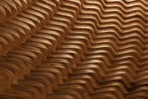 a close up picture of a wavy wood pattern at Sanamane in Naoshima