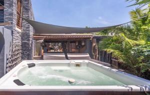 a bath tub sitting on the side of a building at 44SeagullMelkbosstrand in Melkbosstrand