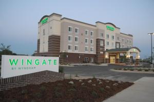 a wyncote hotel with a sign in front of it at Wingate by Wyndham Loveland Johnstown in Loveland