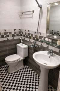 a bathroom with a toilet and a sink at Thành Trung Motel in Cat Ba +17 photos
