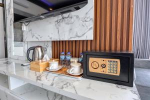 a counter with a microwave on top of a table at Kelingking Point in Nusa Penida
