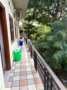 a porch of a house with a green trash can at Hotel Vishal in Jaipur