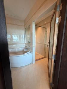 a large bathroom with a tub and a shower at Gooseberry Baan & Bistro in Pattaya South +31 photos