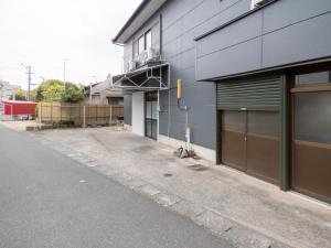 an empty street in front of a building at inn 3rd in Kurashiki