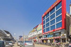 a busy city street with cars and buildings at Highway Grand Residency in Hyderabad