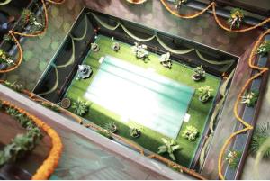 an overhead view of a table with a pool at Highway Grand Residency in Hyderabad