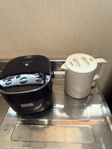 a toaster and a toaster sitting on a counter at inn 3rd in Kurashiki +16 photos