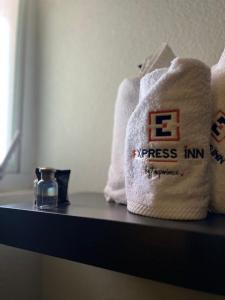 a towel sitting on a shelf in a bathroom at Hotel Granada in Puebla