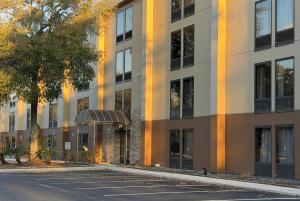 an empty parking lot in front of a building at Wingate by Wyndham Jacksonville FL in Jacksonville