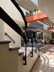a set of stairs in a building with a lobby at Hotel Granada in Puebla