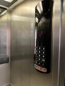 a remote control is attached to a elevator at Hotel Granada in Puebla