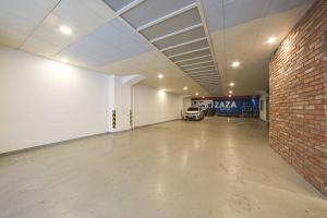 a large empty garage with a brick wall at ZaZa HOTEL in Bucheon