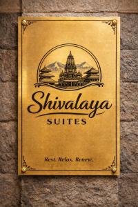 a sign for shivajaya suites on a wall at Shivalaya Suites in Pātan