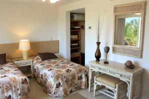 a bedroom with two beds and a window at Marina Costa Bonita in Mazatlán