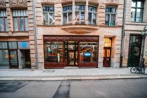 a building on a city street with a building at Marios Mansion in Leipzig