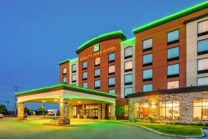 a hotel with a sign on the front of it at Quality Inn & Suites in Lévis