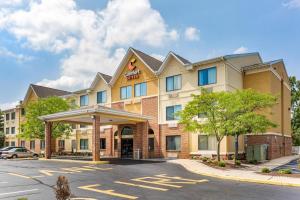 a rendering of a hotel with a parking lot at Comfort Suites Dover University Area in Dover