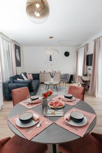 a living room with a table with plates of food on it at Wonder Bűbáj Mátrafüred in Gyöngyös +9 photos
