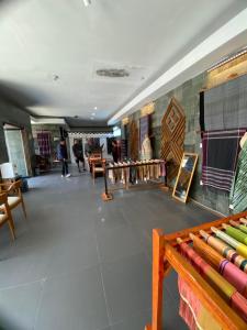 a room filled with lots of different types of furniture at Batu Katak Jungle River & Trekking in Bukit Lawang