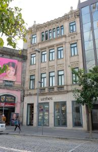 a building on the corner of a street at LETHESHOME Apartments in Porto
