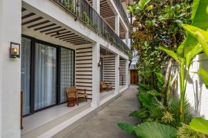 an internal courtyard of a house with plants at Palermo Suites by DH in Ubud +25 photos