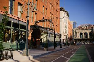 a city street with buildings and a street light at The Oxford Hotel in Denver