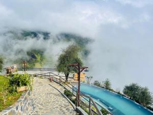 a swimming pool with smoke coming out of it at Ta Xua Ecolodge in Bắc Yên