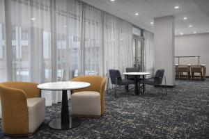 a conference room with tables and chairs and windows at Hampton Inn Washington DC NoMa Union Station in Washington, D.C. +30 photos