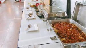 a buffet line with many different types of food at Lake Terrace Resort in Langu
