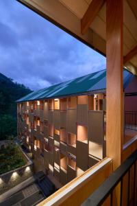 a balcony view of a building with lights at Te Dalu Resort & Spa - A Luxury Sanctuary in Ella in Ella