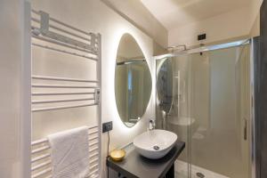 a white bathroom with a sink and a shower at San Carlo Suite Torino in Turin +105 photos