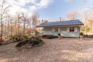 a small house with a solar roof on a yard at Il était une fois in Champeau +26 photos
