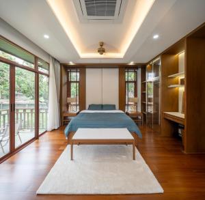 a bedroom with a bed and a table at Spoonamore Villa in Hang Dong +57 photos