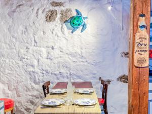 a table with plates and glasses on top of it at Appartement 5 personnes Centre d'Agde in Agde +14 photos