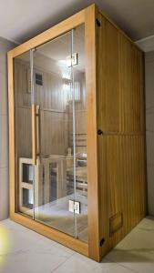 a sliding glass door in a room with a table at Vikendica 937 Lux & Spa, Istočno Sarajevo, Pale, Jahorina i Sarajevo na 15km in Pale +24 photos