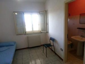 a room with a chair and a window and a sink at Camera singola in affitto con bagno privato interno in Montenero di Bisaccia