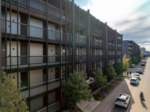 an apartment building with cars parked on a street at b20 - serviced apartments bern ag in Bern
