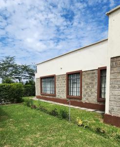 a building with windows on the side of it at Swara Homes Nanyuki in Nanyuki