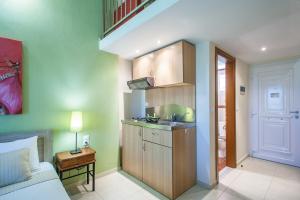 a small kitchen in a room with a couch at Syrainas studios in Troulos +28 photos