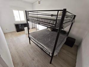 a couple of bunk beds in a room at GuestHouse Relax & Pool in Esmoriz +28 photos
