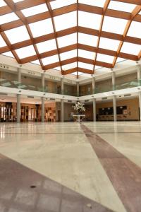 an empty lobby with a large room with a large ceiling at Los Claustros de Ayllón in Ayllón