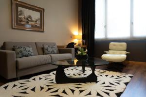 a living room with a couch and a coffee table at Los Claustros de Ayllón in Ayllón