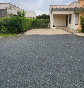 a driveway in front of a house with a garage at Swara Homes Nanyuki in Nanyuki