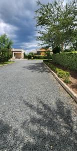 an empty road in front of a house at Swara Homes Nanyuki in Nanyuki
