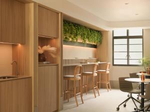 a kitchen and dining room with a table and chairs at The Initial Sama Serviced Residences in Singapore